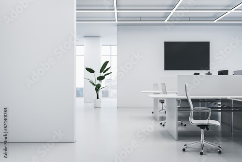 Fototapeta Naklejka Na Ścianę i Meble -  Clean concrete coworking office interior with window and city view, empty black screen, decorative plants and furniture. 3D Rendering.