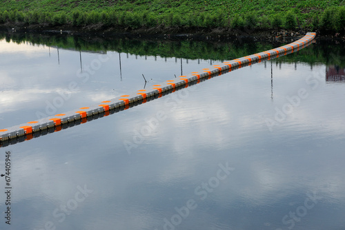 plastic pontoon bridge that can float on a sea or lake. Blue Plastic Modular Floating Dock on the Sea