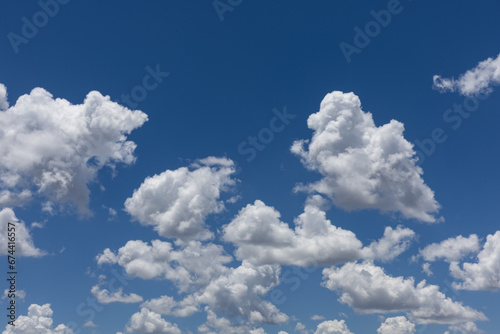 White clouds in a bright blue sky