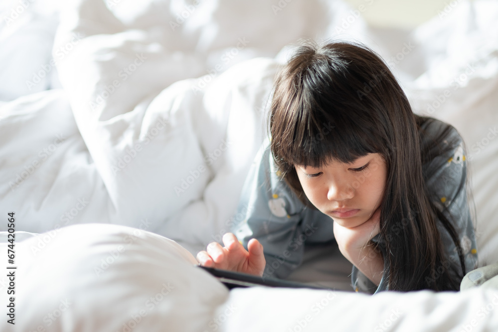 kid is addicted to tablet, little girl playing smartphone, kid use telephone, watching cartoon kid is addicted to tablet, little girl playing smartphone, kid use telephone, watching cartoon
