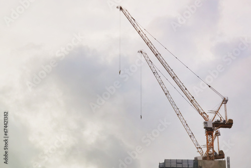 construction of buildings and a crane on blue sky background
