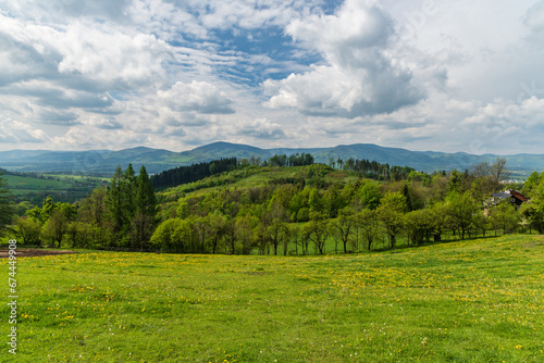 View from Vruzna above Vendryne village in springtime Slezske Beskydy mountains in Czech republic