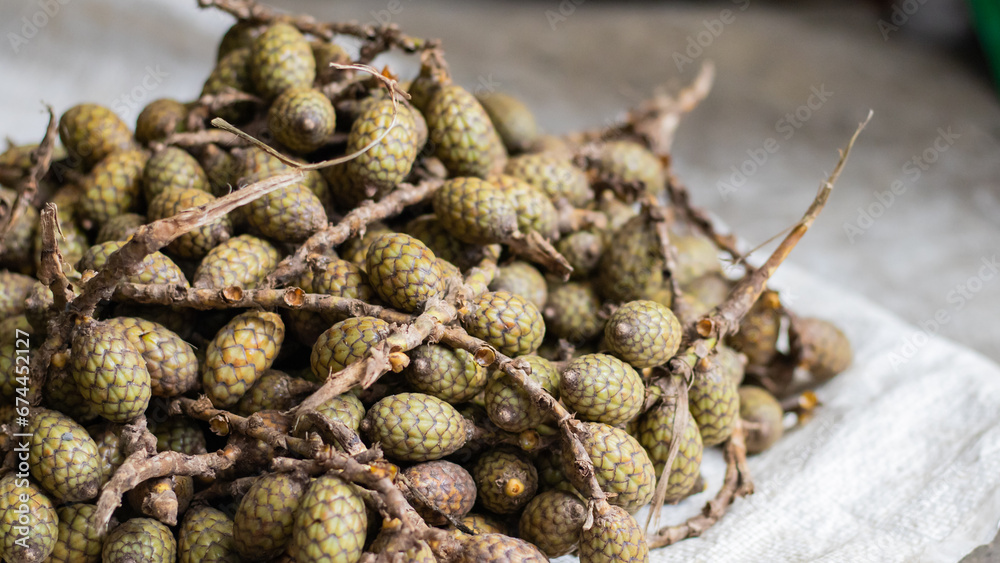 Fototapeta premium Rattan fruits kept in pile at market for selling.