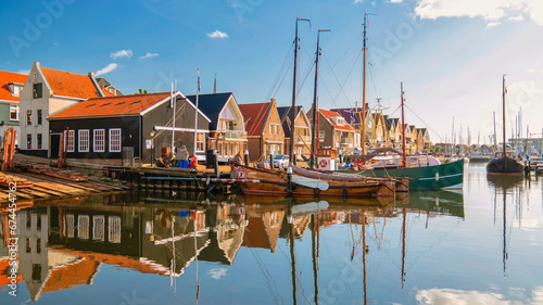 Fototapeta Naklejka Na Ścianę i Meble -  Urk Netherlands, an Old historical harbor on a sunny day, a Small town of Urk village with beautiful colorful streets and houses alongside the harbor by the lake Ijsselmeer Netherlands Flevoland