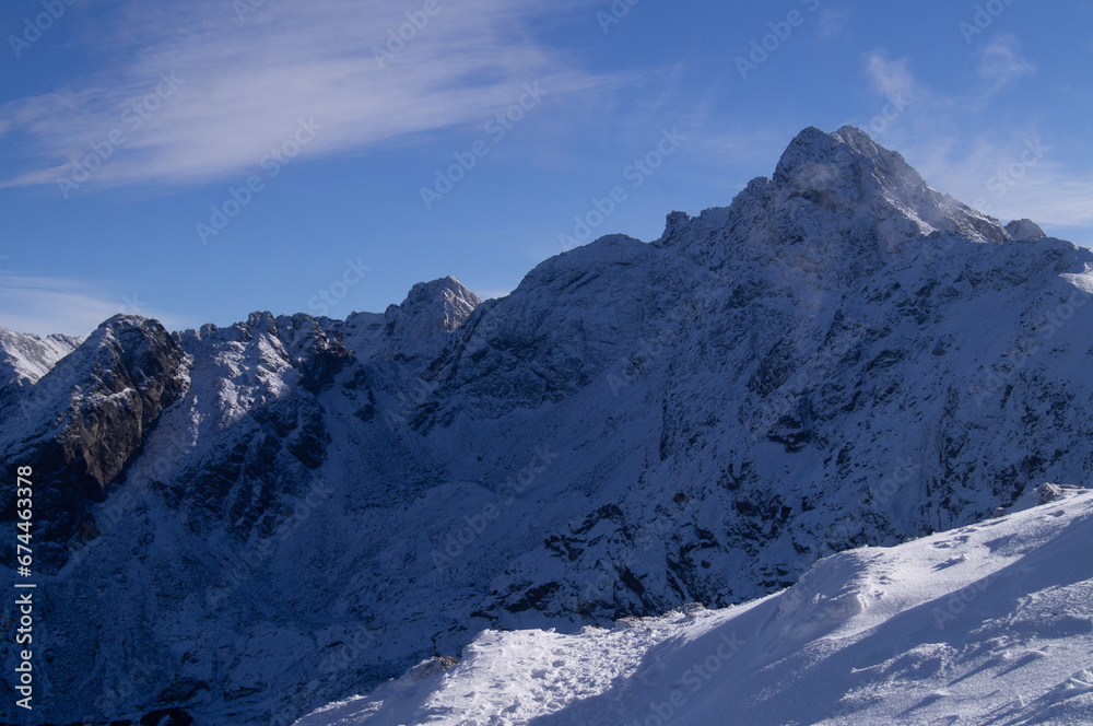 Serene High-Altitude Adventure: Snow-Covered Peaks of the Tatra Range Captured on a Winter Expedition from Kasprowy Wierch, Perfect for Seasonal Publications and Travel Inspirations Serene High-Altitude Adventure: Snow-Covered Peaks of the Tatra Range Captured on a Winter Expedition from Kasprowy Wierch, Perfect for Seasonal Publications and Travel Inspirations