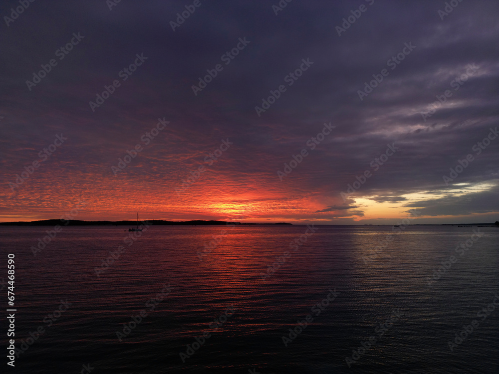 Aerial view of a dramatic sunset along the Adriatic sea coastline near Pula, Istria, Croatia. Aerial view of a dramatic sunset along the Adriatic sea coastline near Pula, Istria, Croatia.
