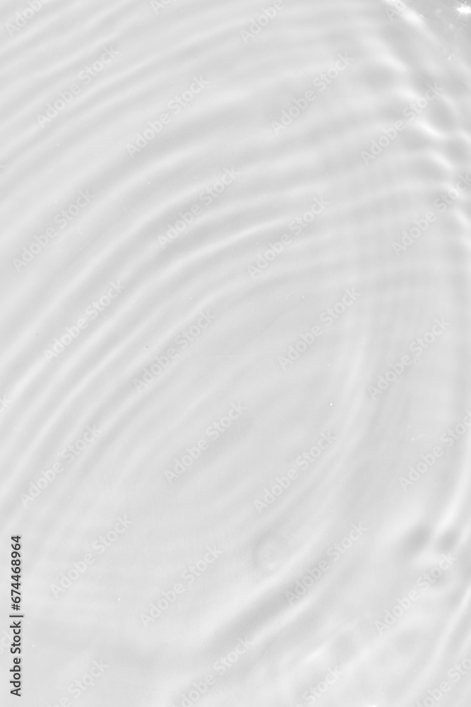 Obraz premium Defocus blurred transparent white colored clear calm water surface texture with splashes reflection. Trendy abstract nature background. Water waves in sunlight with copy space. Blue watercolor shine.