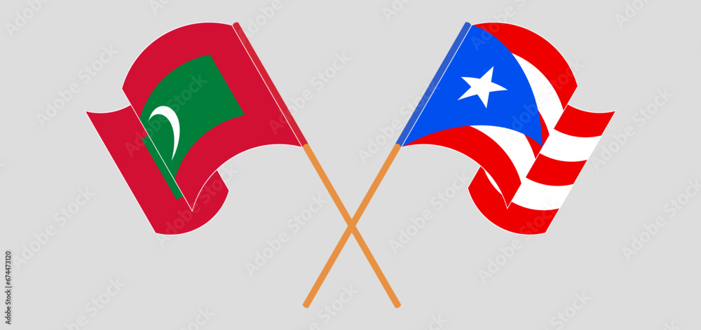 Crossed and waving flags of Maldives and Puerto Rico