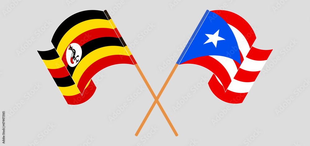 Crossed and waving flags of Uganda and Puerto Rico