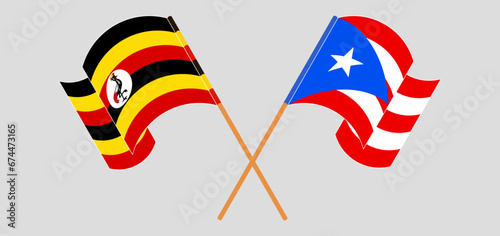 Crossed and waving flags of Uganda and Puerto Rico