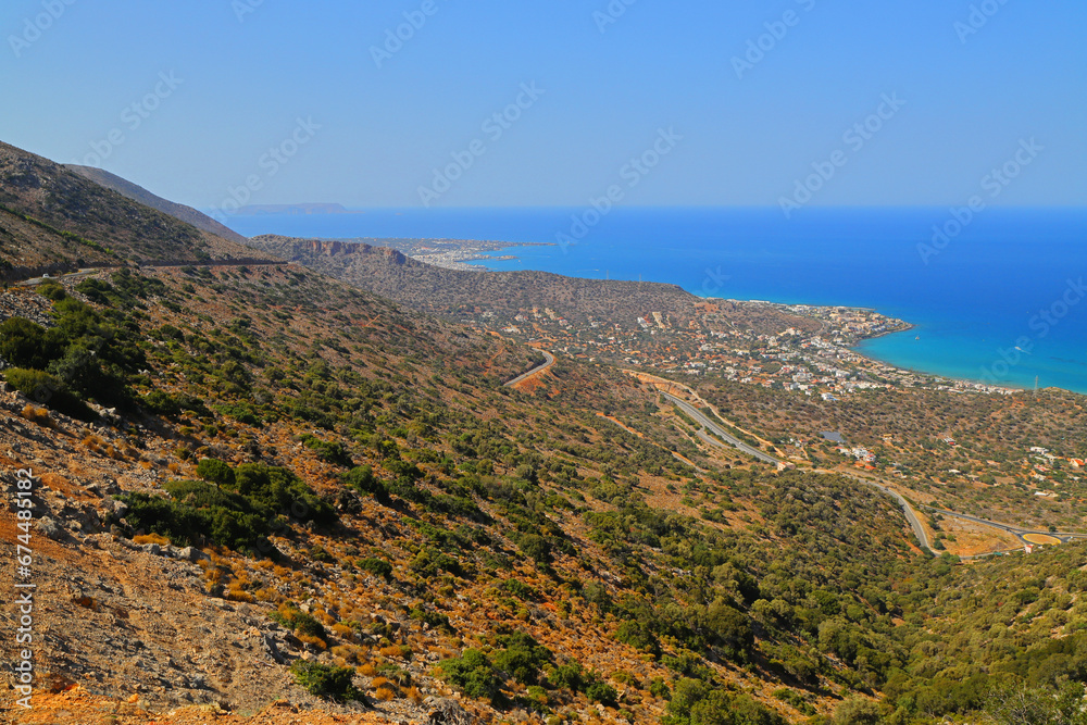 Scenic view of Malia bay with Heraclium in the distance, Crete, Greece, Europe.