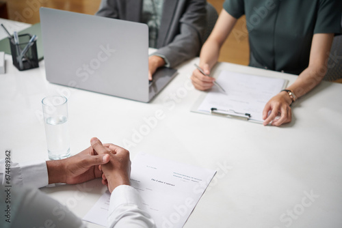Cropped image of applicant attending job interview