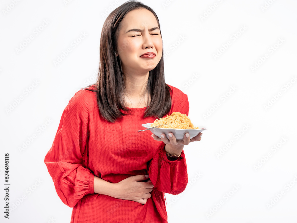 A portrait of a happy Asian woman wearing a red dress, posing hungrily and about to eat noodles. Isolated against a white background. A portrait of a happy Asian woman wearing a red dress, posing hungrily and about to eat noodles. Isolated against a white background.