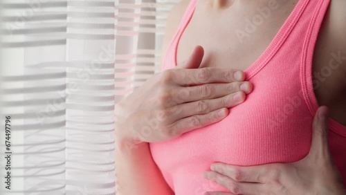 Wallpaper Mural A young woman checks her breasts for tumors and oncology. Self-examination to avoid breast cancer. Torontodigital.ca
