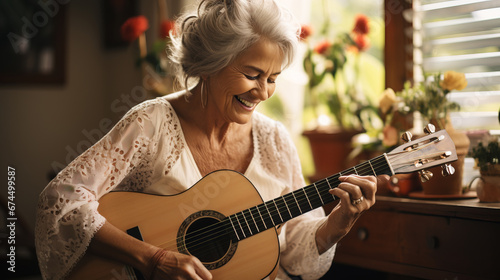senior woman playing guitar photo