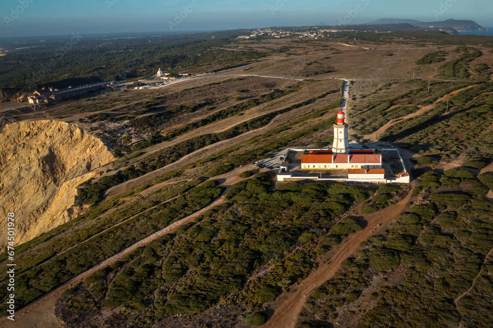 Beautiful landscape with lighthouse, cape Espichel at sunset, Portugal
