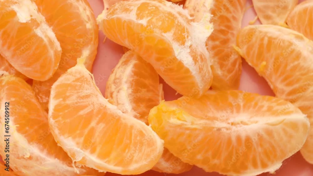 Tangerine slices, rotation in circle. orange fresh peeled tangerines, Turning. selective focus Tangerine slices, rotation in circle. orange fresh peeled tangerines, Turning. selective focus