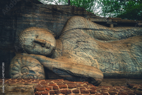 Reclining Buddha statue at Gal Vihara, the Rock Temple, in Polonnaruwa, sri lanka photo