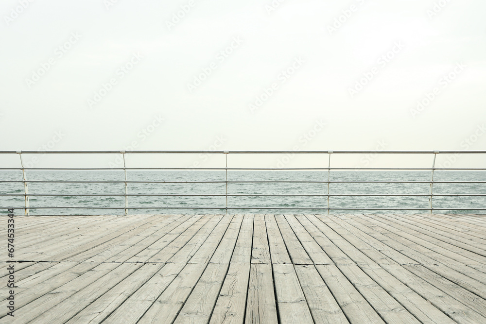 Wooden embankment on sea, space for text