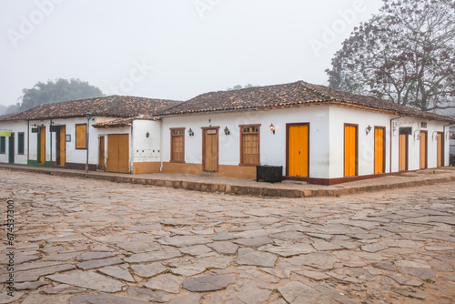 Fotografie Fog apparent on the stone streets and colonial houses in the historic city of Tiradentes, Minas Gerais, Brazil