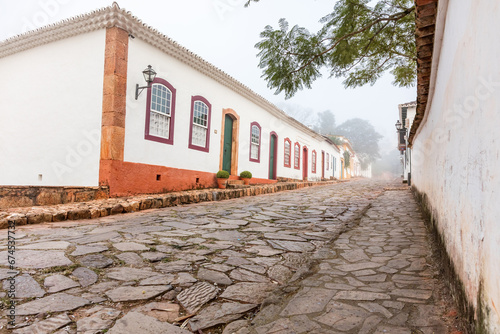 Fotografie Fog apparent on the stone streets and colonial houses in the historic city of Tiradentes, Minas Gerais, Brazil
