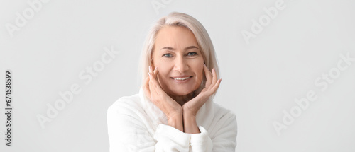 Mature woman giving herself...