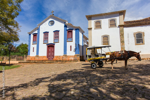 Cart and horse on a street in the city of Tiradentes, Minas Gerais, Brazil. Old wagon for a ride in the historic colonial city photo
