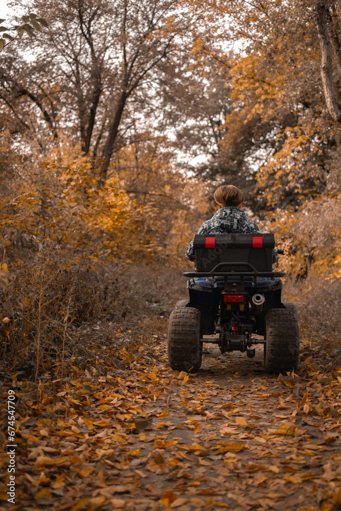 Fototapeta premium A trip on the ATV on the red road.