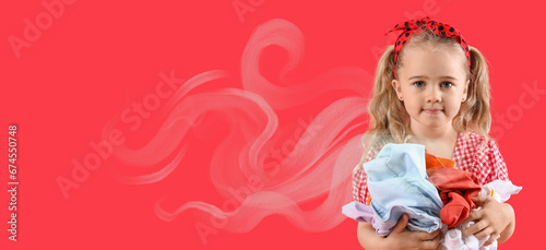 Cute little girl holding la...