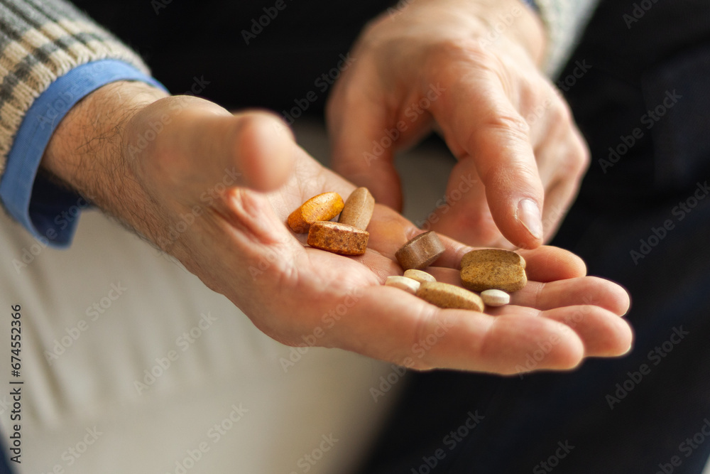 Hands with pills. Senior man hands holding medical pill. Mature old senior grandfather taking medication cure pills vitamin. Age prescription medicine healthcare therapy concept Hands with pills. Senior man hands holding medical pill. Mature old senior grandfather taking medication cure pills vitamin. Age prescription medicine healthcare therapy concept