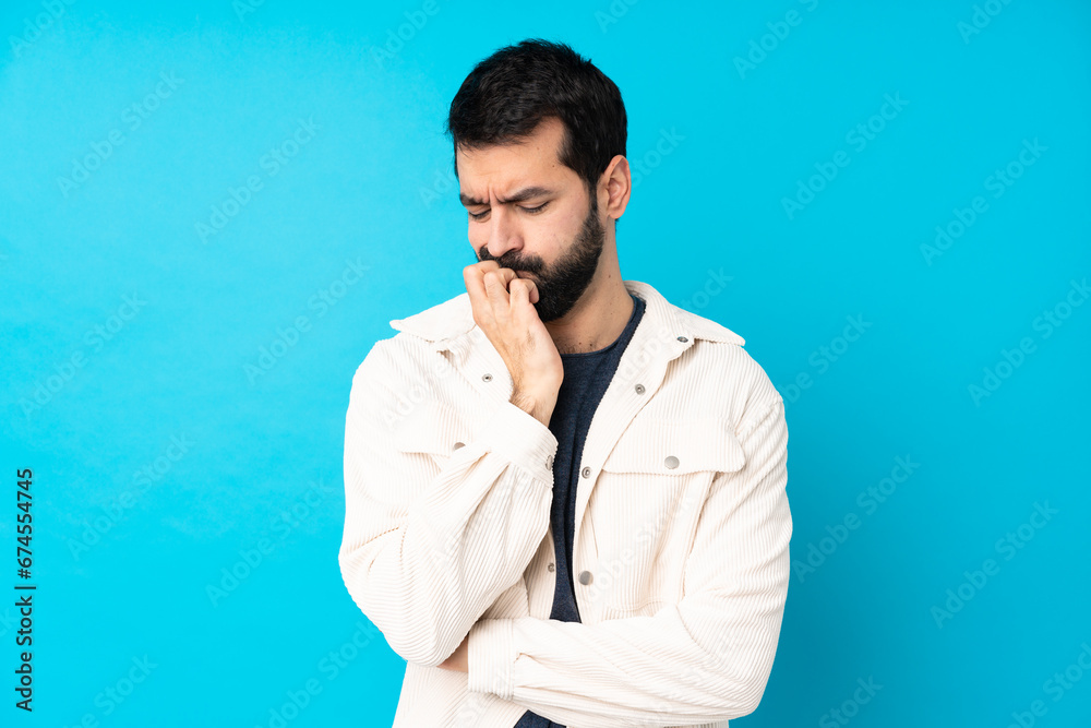 Young handsome man with white corduroy jacket over isolated blue background having doubts Young handsome man with white corduroy jacket over isolated blue background having doubts