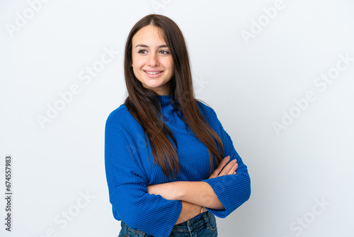 Young Ukrainian woman isolated on white background with arms crossed and happy