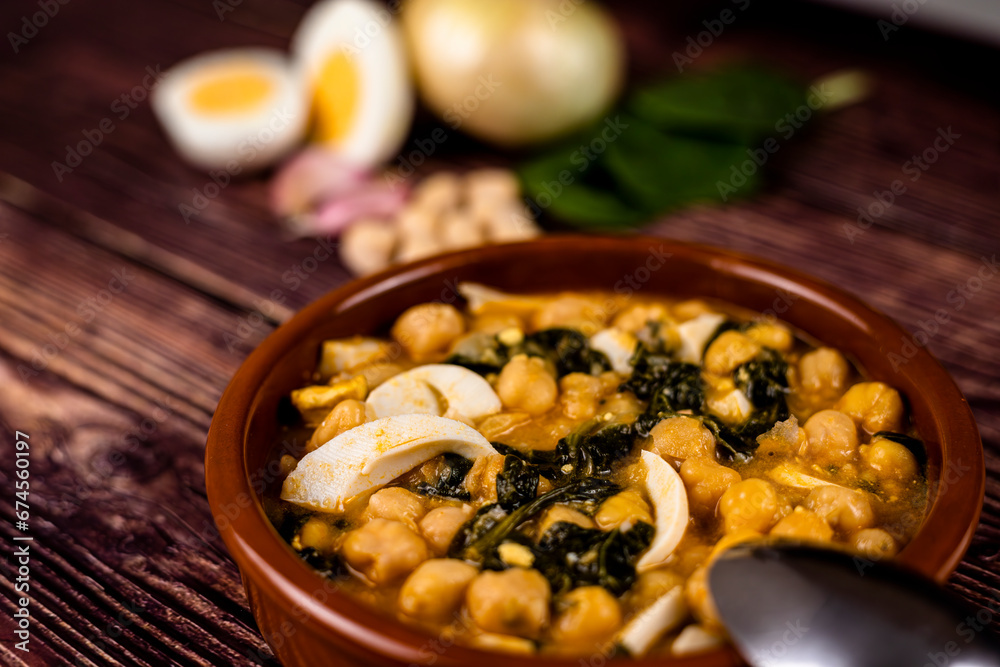 Delicious and traditional dish of chickpea stew with spinach and egg Delicious and traditional dish of chickpea stew with spinach and egg