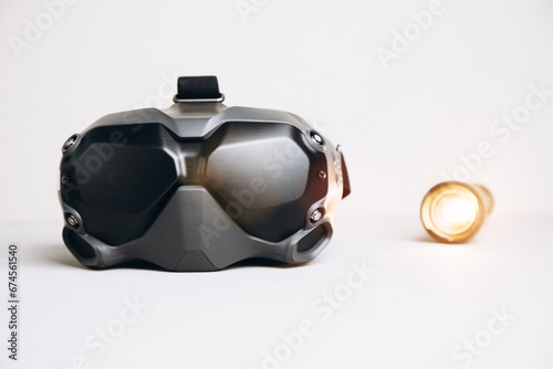 Close-up of black virtual reality glasses on a white background. Glasses for controlling drones. Front view