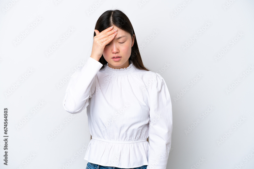 Young Chinese woman isolated on white background with headache Young Chinese woman isolated on white background with headache