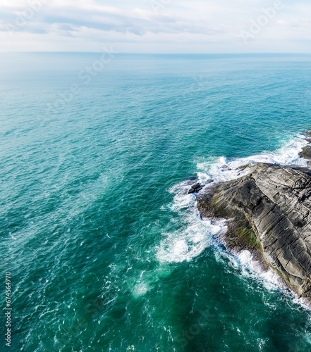 Centro, ES, Brazil Aerial Shot of Waves Crashing the Coastal Rocks