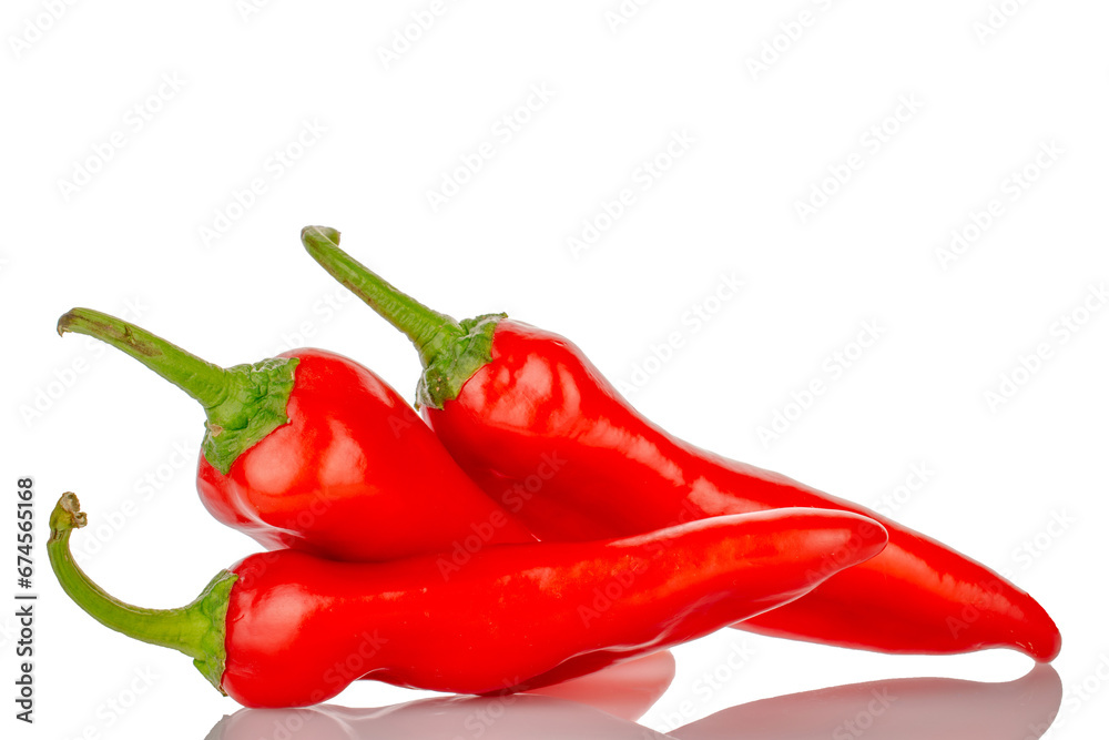 Three sweet red peppers, macro, isolated on white background. Three sweet red peppers, macro, isolated on white background.