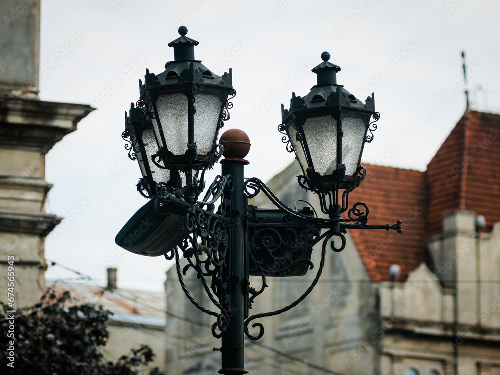 Street lamppost with three antique-style lanterns Street lamppost with three antique-style lanterns
