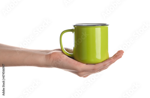 Woman holding green cup of hot coffee on white background