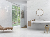 A lavish bathroom with glossy white marble, basin and round classy mirror above it, hanging bathrobe next to a window, and a sophisticated light fixture and tiny table with toiletries. 3D 