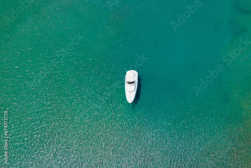 Aerial view of a boat in the sea. Top view. © Robert Kiyosaki