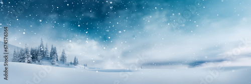 Beautiful ultrawide background image of light snowfall falling over of snowdrifts.