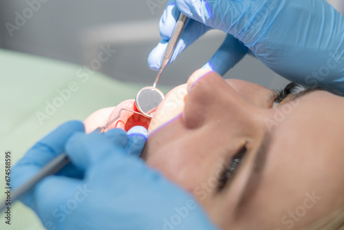young girl recieve tooth treatment in modern dental clinic