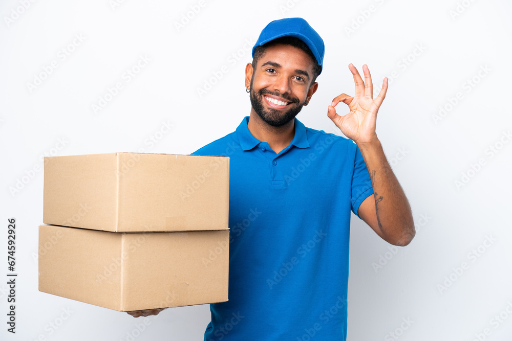 Delivery Brazilian man isolated on white background showing ok sign with fingers Delivery Brazilian man isolated on white background showing ok sign with fingers