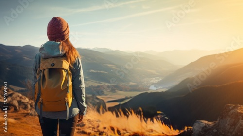rear view traveller backpacker hiking walking up on top the landscape mountain looking at the contour of beautiful mountain peak and field nature scenery view point travel background concept