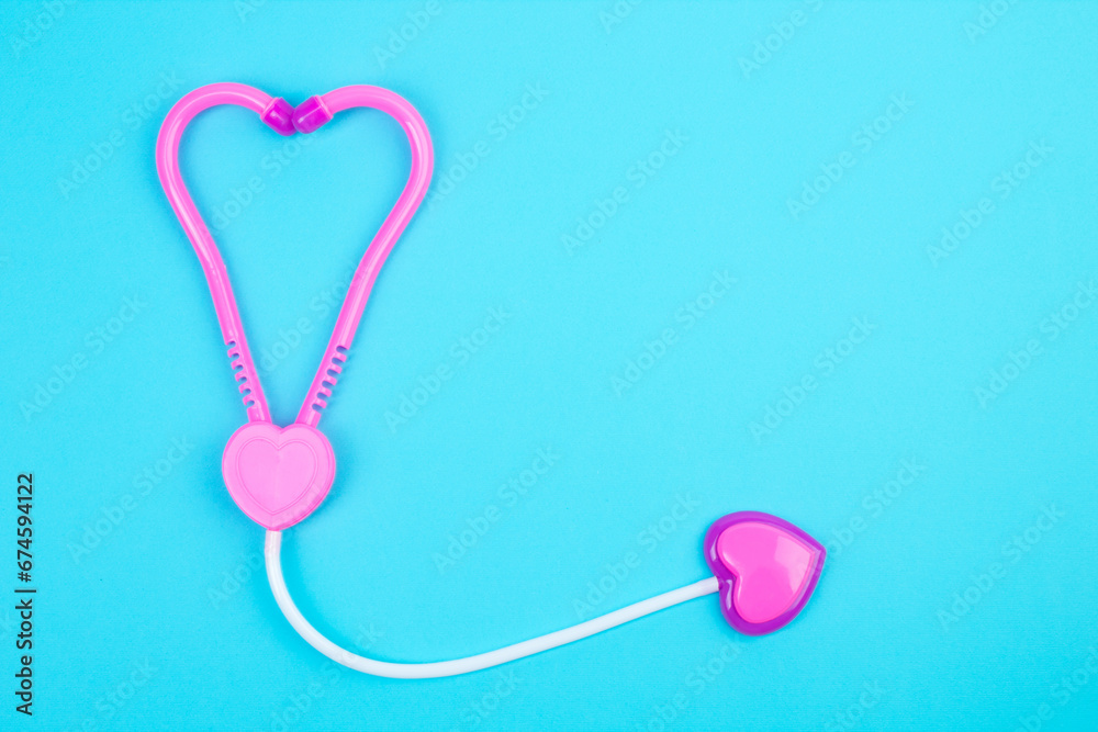 The concept of a pediatrician. Pediatrics. Toy medical devices on a blue background. Children play professional doctor. Choice of profession. Get vaccinated. Stethoscope.