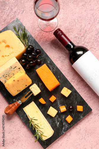 Board with tasty cheese, gr...