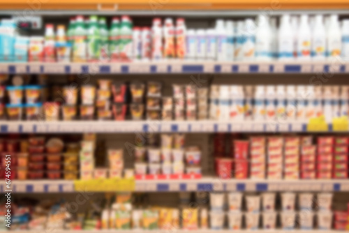 Blur abstract background. Grocery Store concept. Supermarket refrigerator with various products.