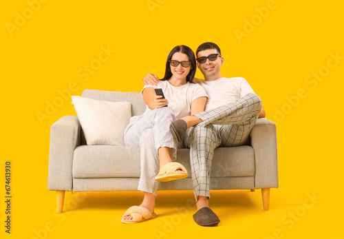 Happy young couple sitting ...