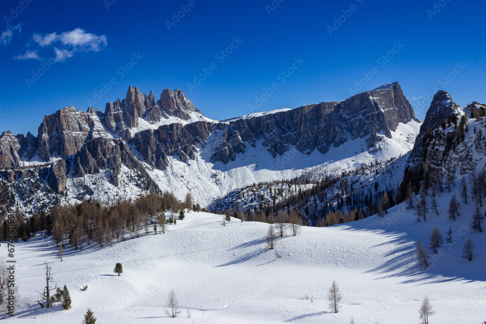Winter landscape of the Italian mountains. View of Monte Lastoni di Formin. View of the mountains near the Cinque Torri refuge. Particular light, blue intensity.